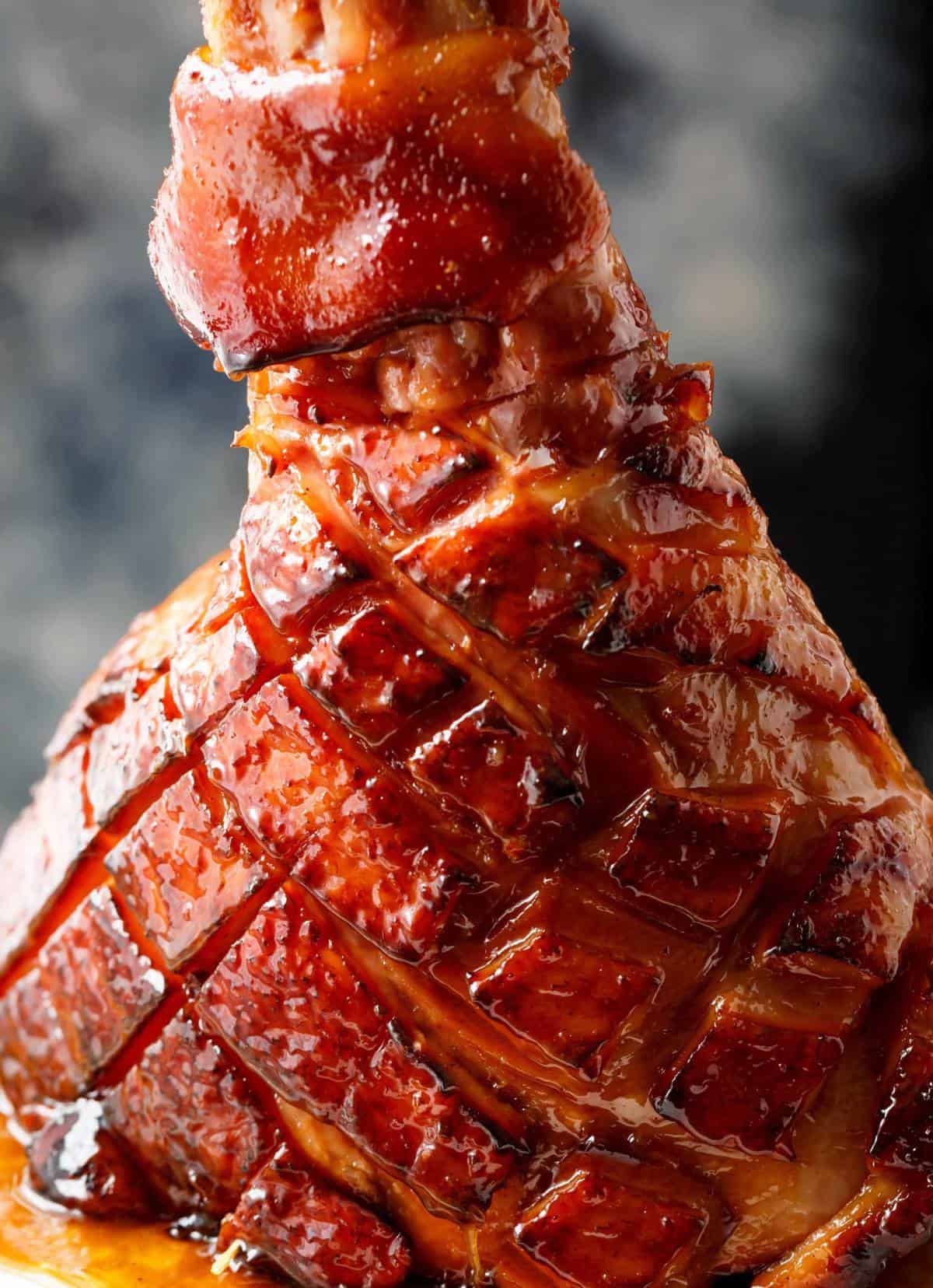 brown sugar mustard glazed ham on white plate - gourmet meat recipe